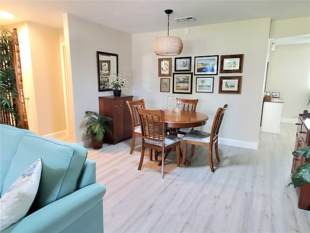 dining area with light wood-type flooring