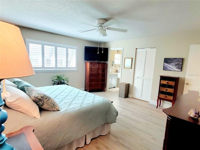 bedroom featuring connected bathroom, ceiling fan, and hardwood / wood-style floors