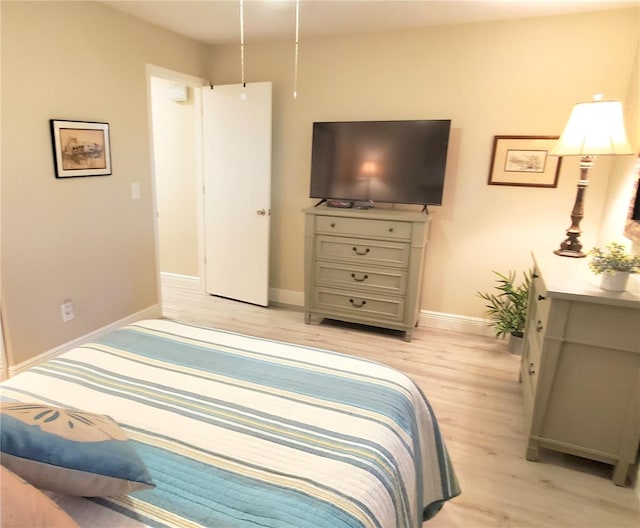 bedroom with light wood-type flooring