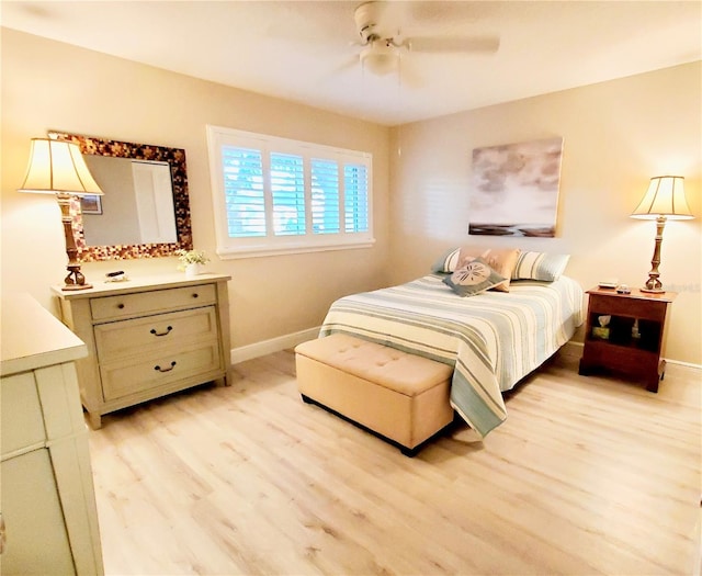 bedroom with light wood-type flooring and ceiling fan