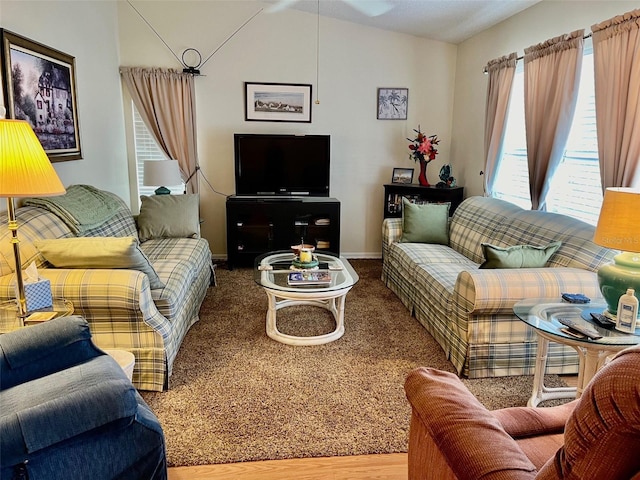 living room featuring hardwood / wood-style floors and vaulted ceiling