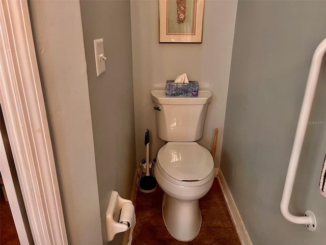 bathroom with tile patterned flooring and toilet