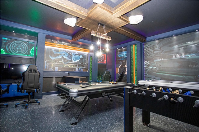 recreation room with beamed ceiling