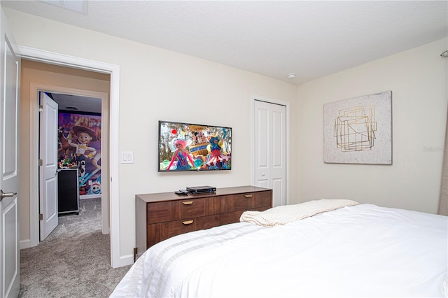 bedroom featuring light colored carpet and a closet