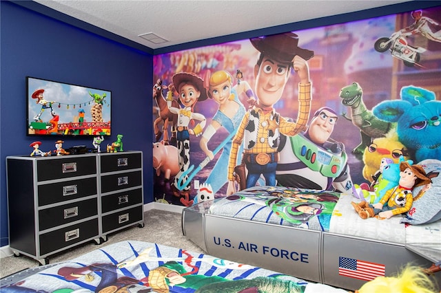 carpeted bedroom featuring a textured ceiling