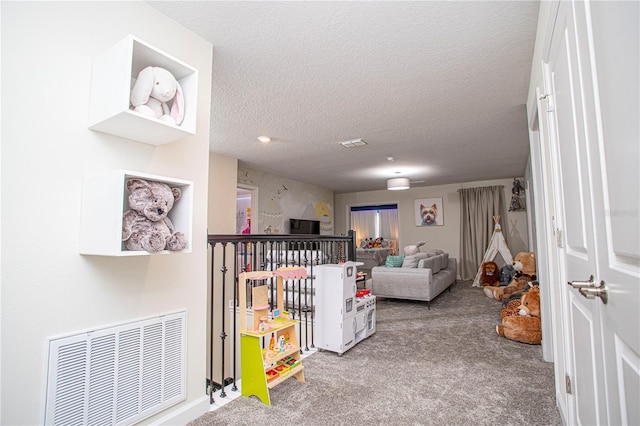 living room with light carpet and a textured ceiling