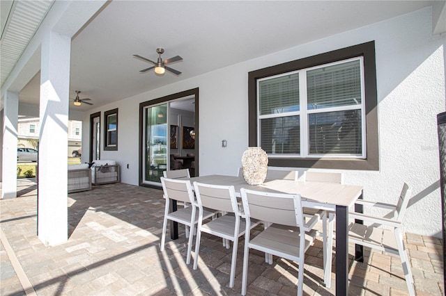 view of patio / terrace featuring ceiling fan