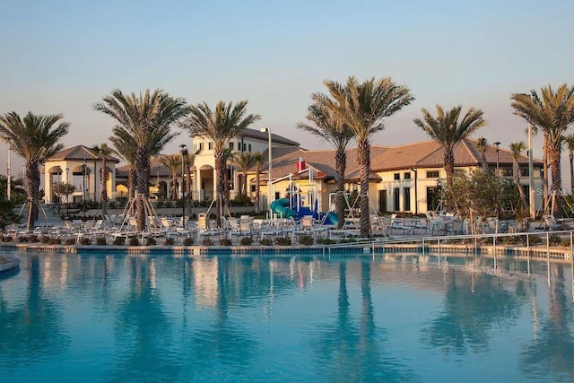 view of pool at dusk