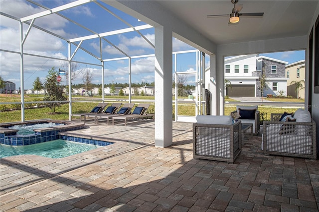 view of patio with ceiling fan, a pool with hot tub, and a lanai