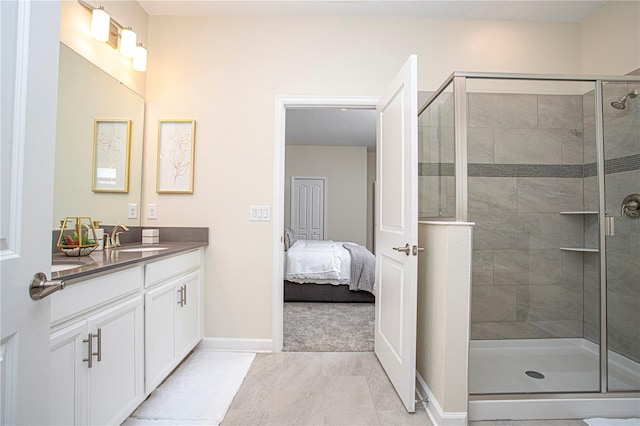 bathroom with vanity, tile patterned floors, and walk in shower