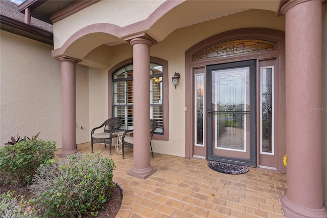 doorway to property with covered porch