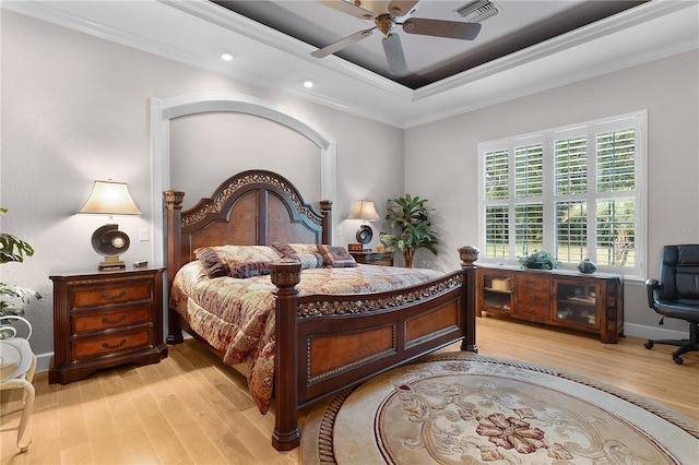 bedroom with ceiling fan, light hardwood / wood-style floors, and ornamental molding