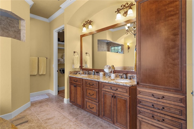 bathroom with tile patterned floors, vanity, and ornamental molding