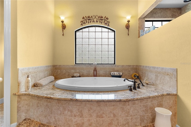 bathroom featuring tiled bath