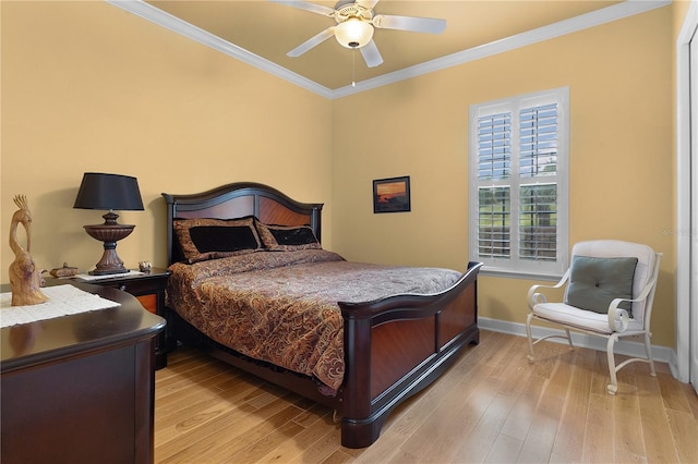 bedroom with ceiling fan, light hardwood / wood-style floors, and ornamental molding