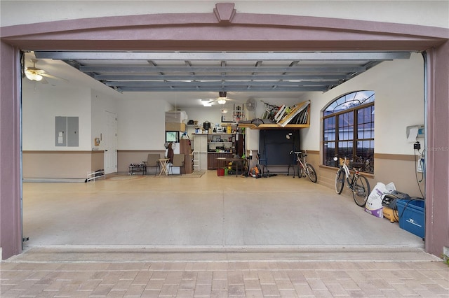 garage featuring electric panel and ceiling fan