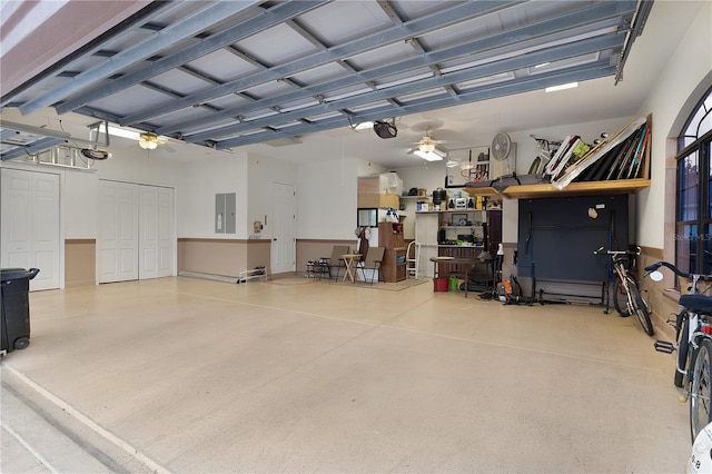 garage featuring ceiling fan and a garage door opener