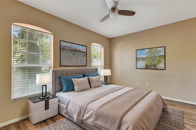 bedroom with light wood-type flooring and ceiling fan