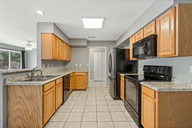 kitchen with ceiling fan, sink, light tile patterned floors, and black appliances