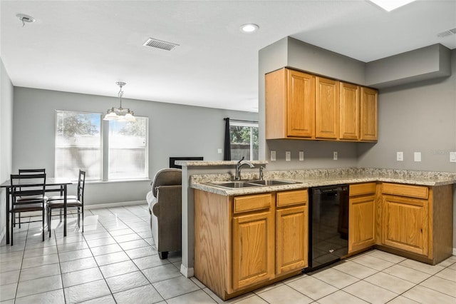 kitchen featuring an inviting chandelier, sink, hanging light fixtures, light tile patterned floors, and black dishwasher