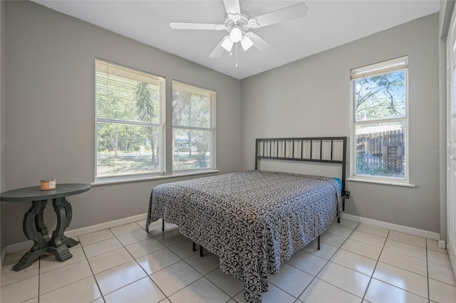 tiled bedroom with ceiling fan