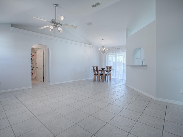 tiled spare room featuring ceiling fan with notable chandelier and lofted ceiling