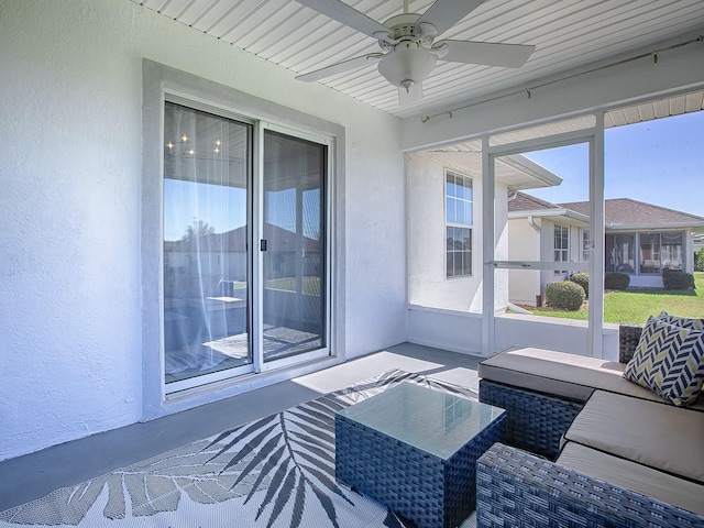 sunroom / solarium with ceiling fan