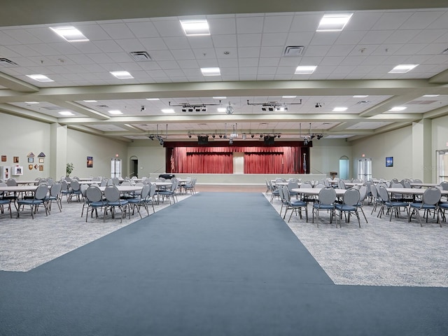 interior space featuring concrete floors and a drop ceiling