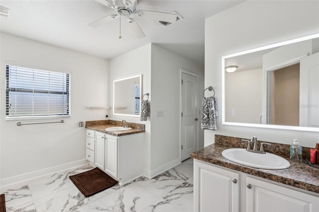 bathroom featuring ceiling fan and vanity