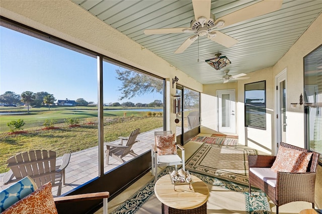 sunroom with ceiling fan and a healthy amount of sunlight