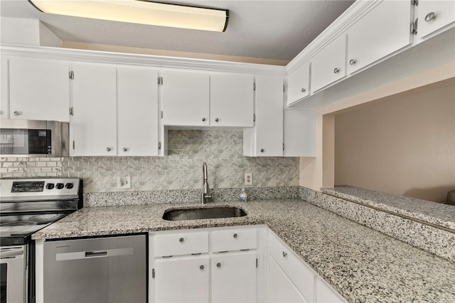 kitchen featuring white cabinets, sink, and stainless steel appliances