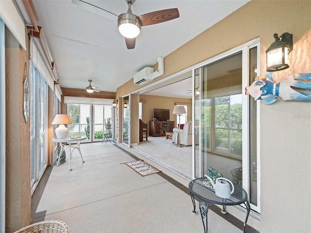 sunroom / solarium with a wall mounted AC and ceiling fan