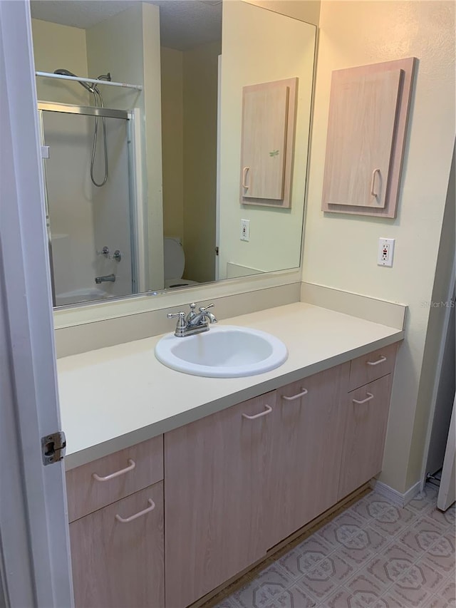 full bathroom featuring vanity, toilet, and tub / shower combination