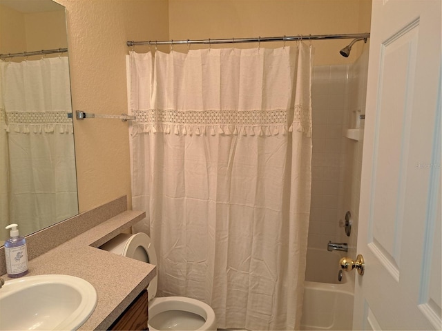 full bathroom with vanity, toilet, and shower / tub combo with curtain