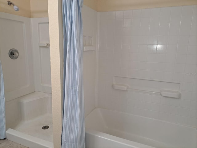 bathroom featuring tile patterned floors and a shower with curtain