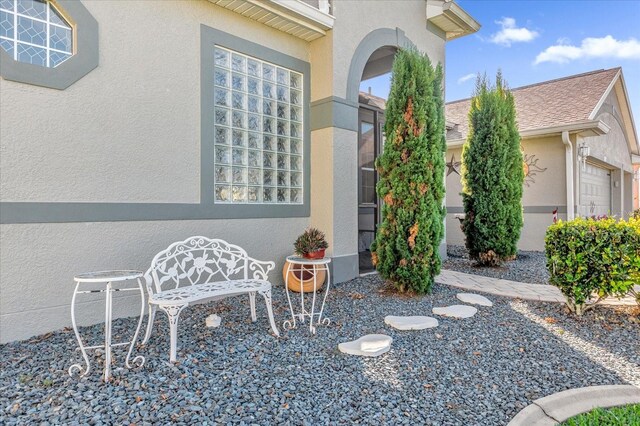 view of patio / terrace featuring a garage