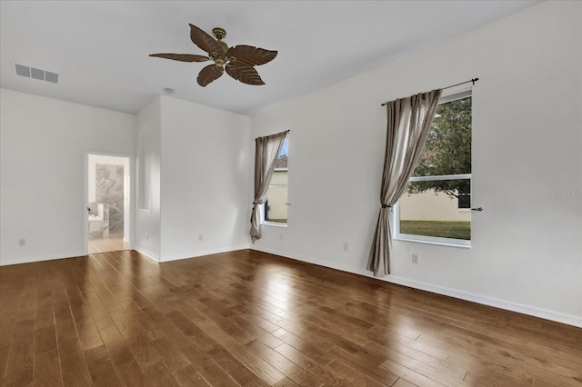 spare room featuring hardwood / wood-style flooring and ceiling fan