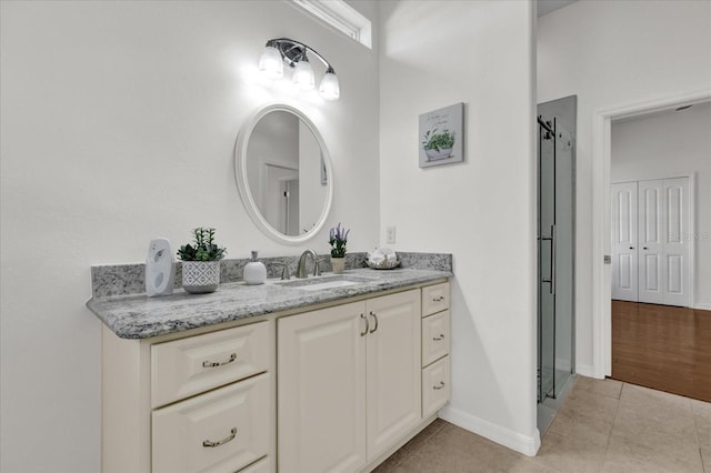 bathroom with vanity and tile patterned flooring