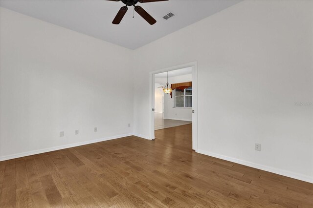 empty room featuring hardwood / wood-style floors and ceiling fan