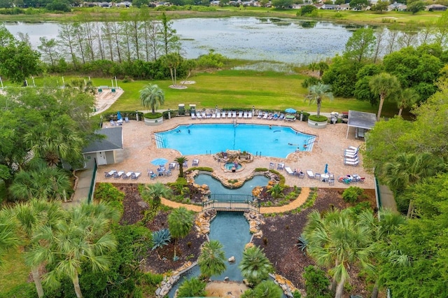 view of swimming pool featuring a water view and a patio