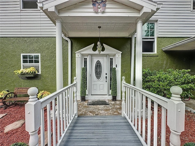 property entrance with covered porch