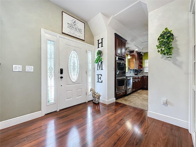 entrance foyer featuring dark hardwood / wood-style flooring and sink