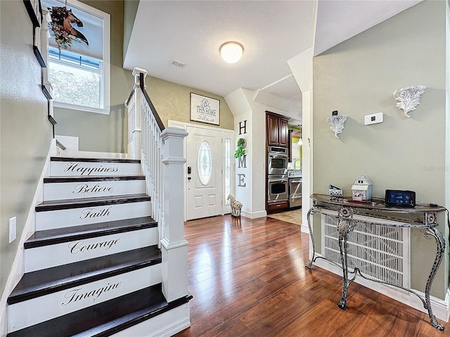 entryway featuring dark wood-type flooring