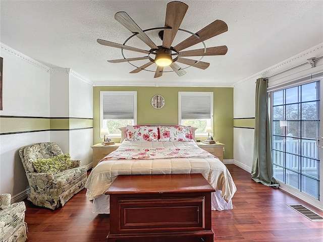 bedroom featuring ornamental molding, dark hardwood / wood-style floors, and multiple windows