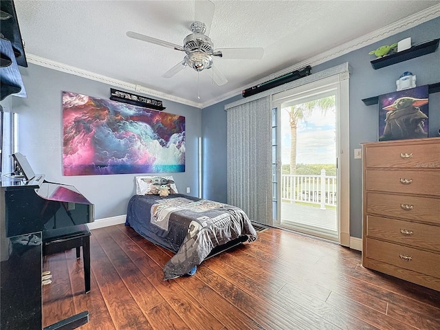 bedroom featuring access to exterior, ceiling fan, a textured ceiling, crown molding, and dark hardwood / wood-style floors