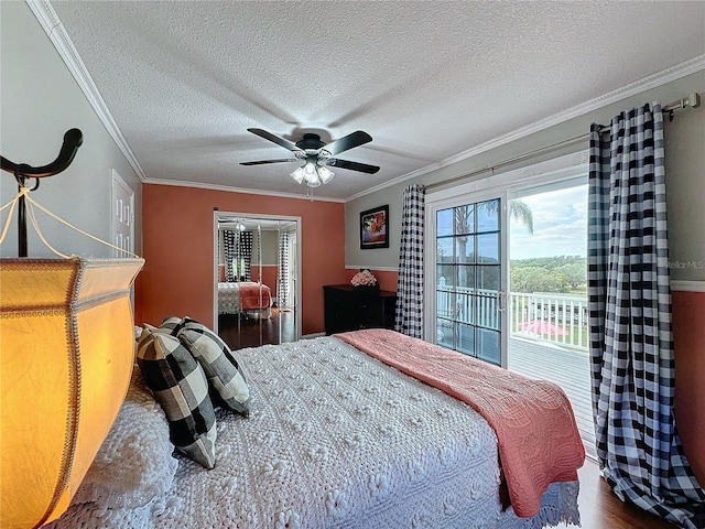 bedroom featuring hardwood / wood-style floors, a textured ceiling, ceiling fan, access to exterior, and ornamental molding