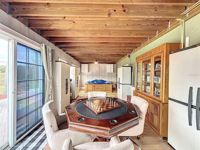 game room featuring light hardwood / wood-style flooring and wood ceiling