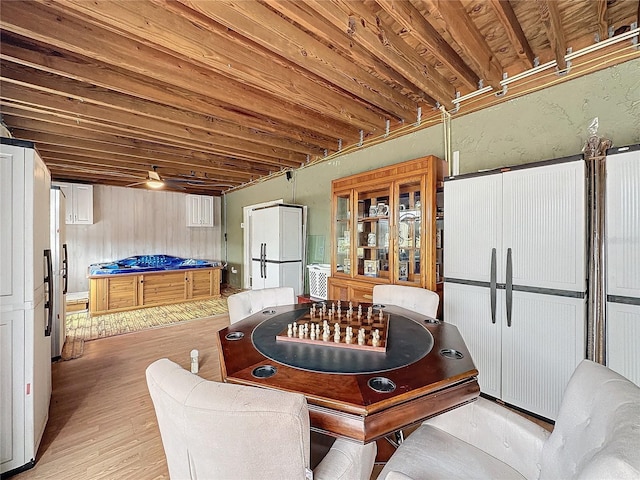 recreation room with light wood-type flooring and ceiling fan