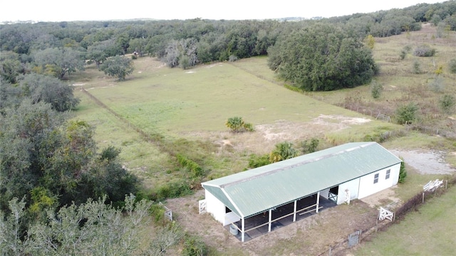 birds eye view of property with a rural view