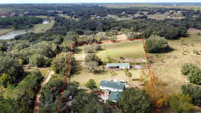 birds eye view of property with a rural view